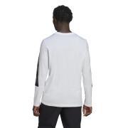 Camiseta de manga larga con estampado de camuflaje adidas Essentials